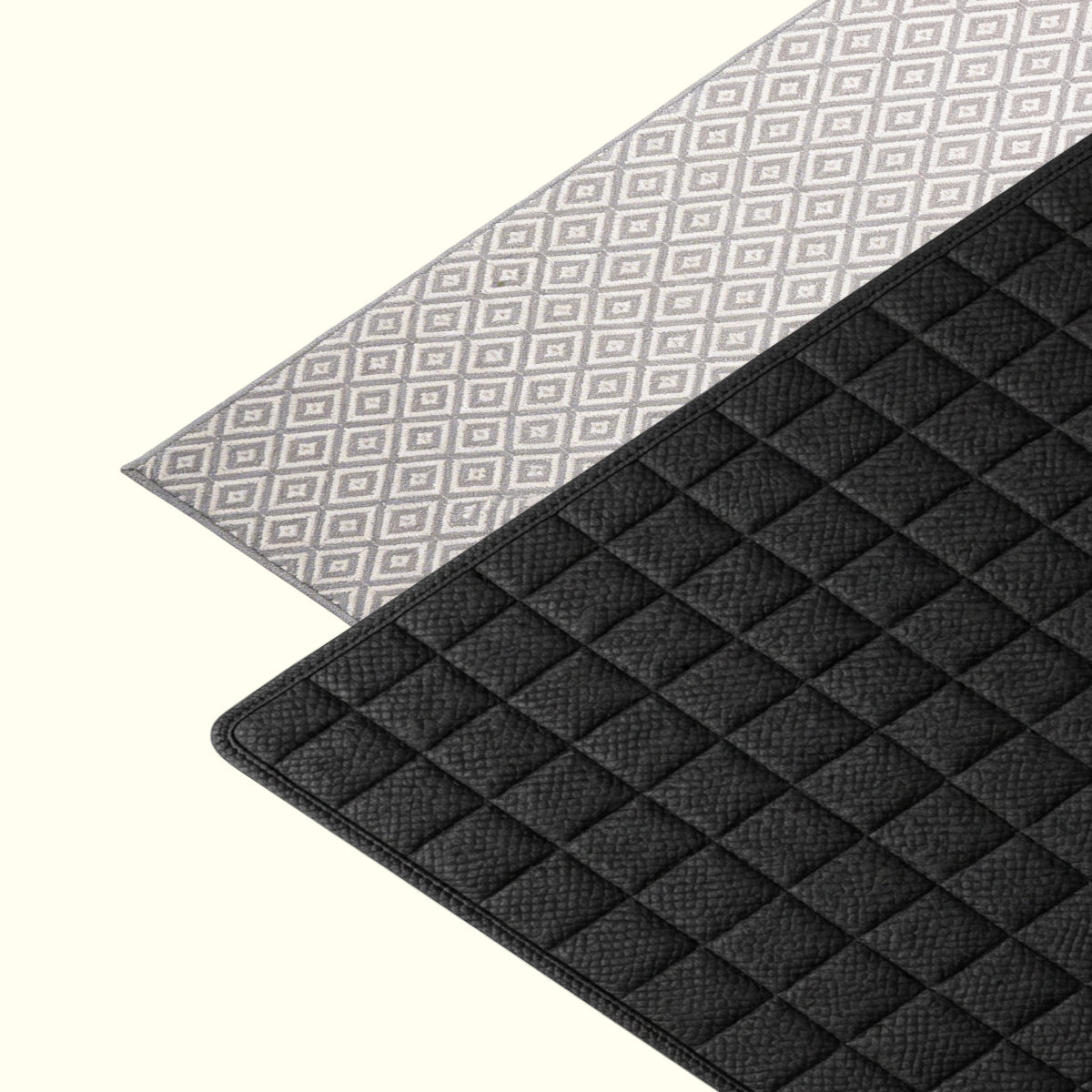 Absorbent dish drying mat holding clean plates, cups, and utensils