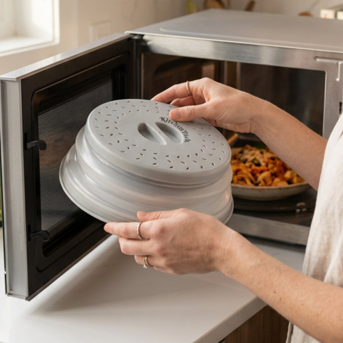 Space-saving microwave food cover collapsed flat for kitchen storage